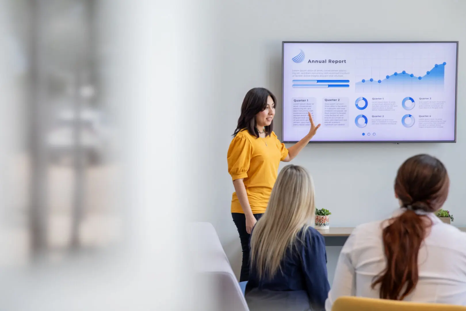 Woman presenting data to colleagues